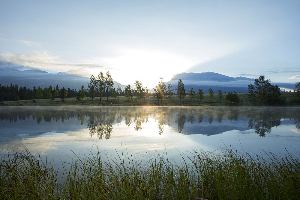 Sunrise reflected in mountain lake