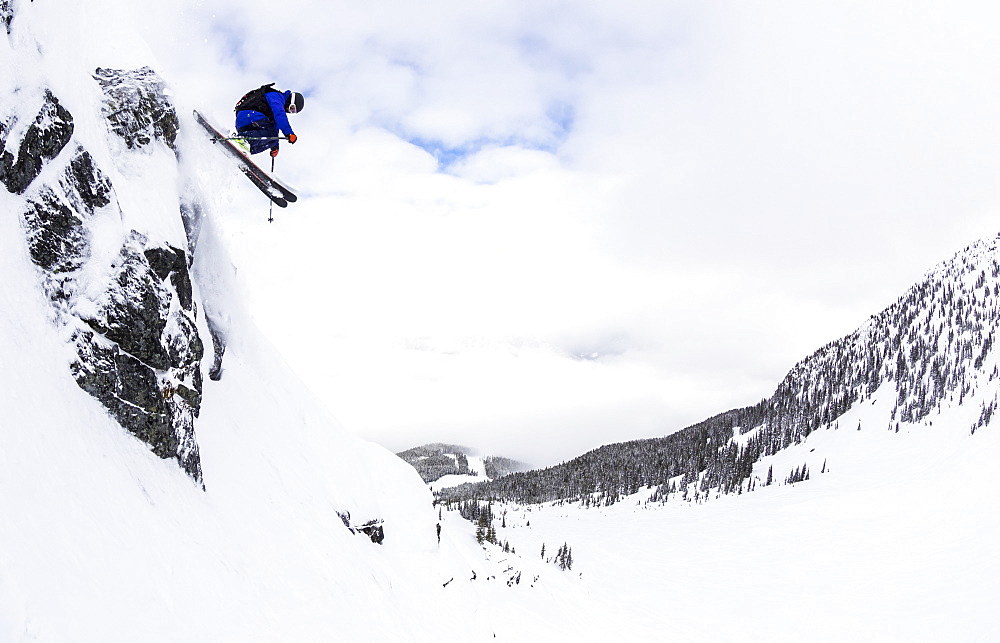 A Man Skis Deep Powder On A Stormy Day At Whistler Blackcomb Ski Resort In British Columbia