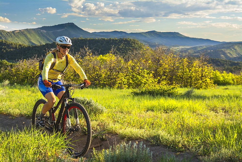 A woman mountain biking on the Horse Gulch Trail System, Durango, Colorado