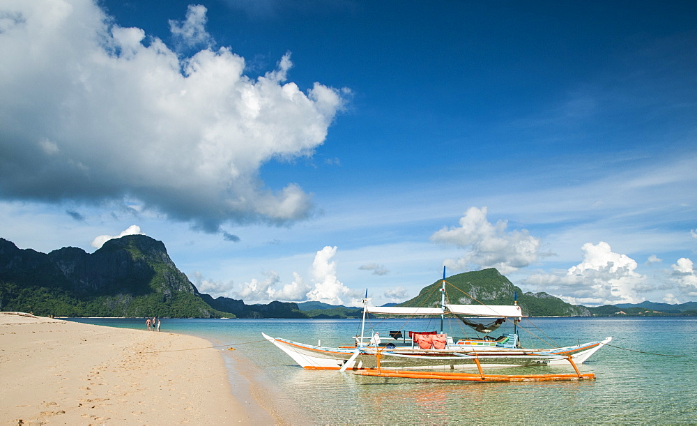 Boat Tied Up To Sandy Tropical Beach In El Nido, Philippines