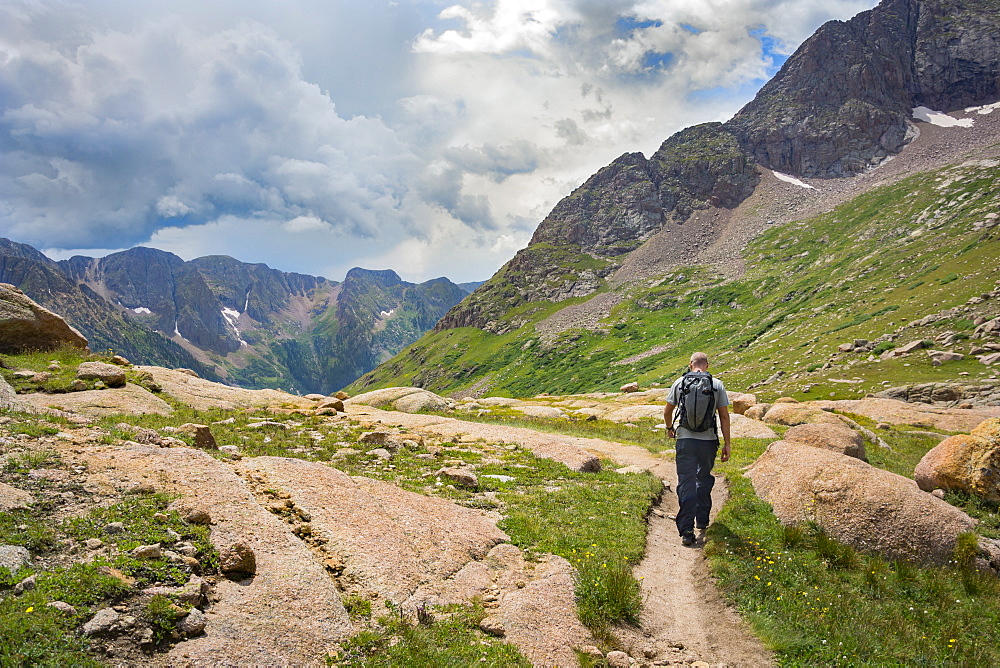 A Man Hiking Through Chicago Basin
