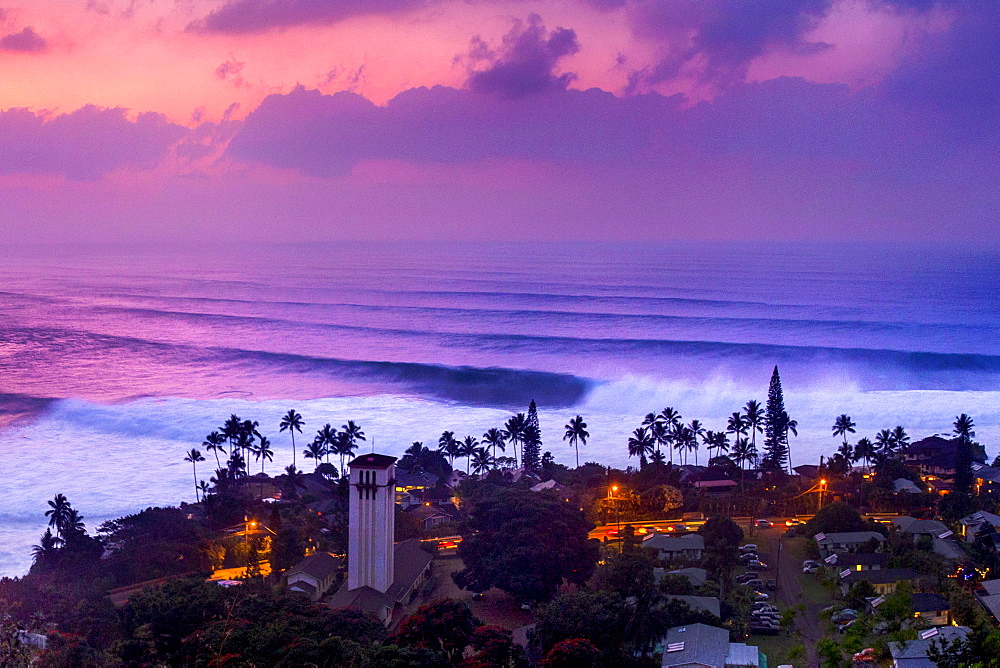 Aerial view of huge waves in Waimea Bay during dramatic sunset