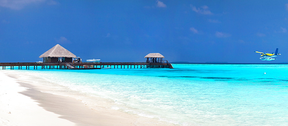 Tropical resort with stilt huts in sea