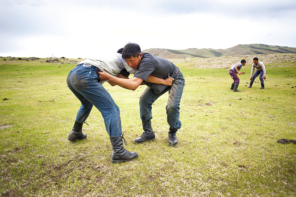 Day of "Gou Barih". Mongolian fight between young man. Orkhon Valley, Mongolia