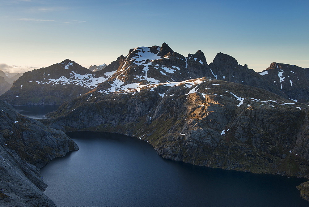View over Fjerddalsvatnet lake towards Munken and surrounding mountains, Moskenesøy, Lofoten Islands, Norway