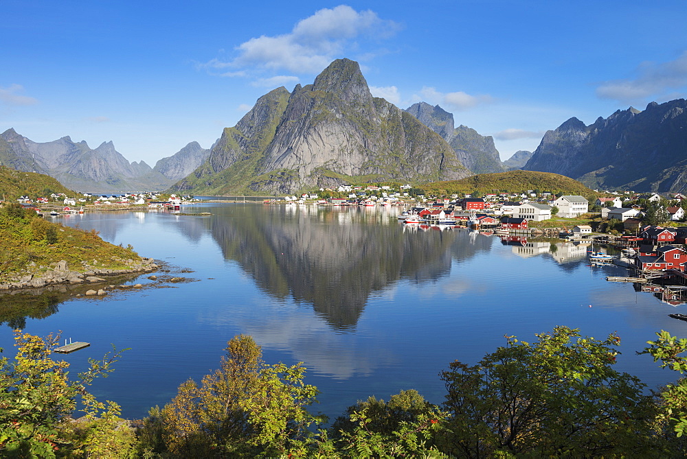 Reflection of Olstind mountain peak in Reine harbor, Moskenesøy, Lofoten Islands, Norway