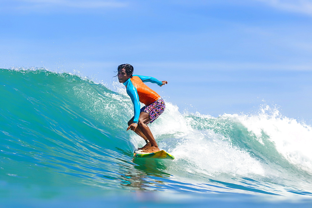 Female surfer on wave