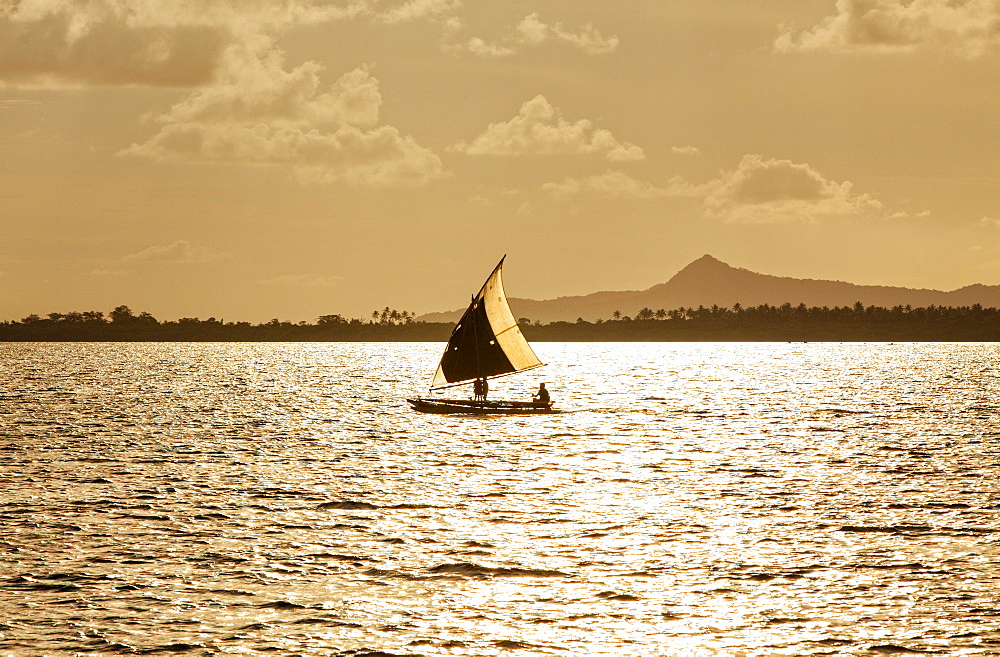 The Louisiade Archipelago is a string of ten larger volcanic islands frequently fringed by coral reefs, and 90 smaller coral islands located 200 km southeast of New Guinea, stretching over more than 160 km and spread over an ocean area of 26,000 km? between the Solomon Sea to the north and the Coral Sea to the south. The aggregate land area of the islands is about 1,790 km? (690 square miles), with Vanatinai (formerly Sudest or Tagula as named by European claimants on Western maps) being the largest.Sideia Island and Basilaki Island lie closest to New Guinea, while Misima, Vanatinai, and Rossel islands lie further east. The archipelago is divided into the Local Level Government (LLG) areas Louisiade Rural (western part, with Misima), and Yaleyamba (western part, with Rossell and Tagula islands. The LLG areas are part of Samarai-Murua District district of Milne Bay. The seat of the Louisiade Rural LLG is Bwagaoia on Misima Island, the population center of the archipelago.