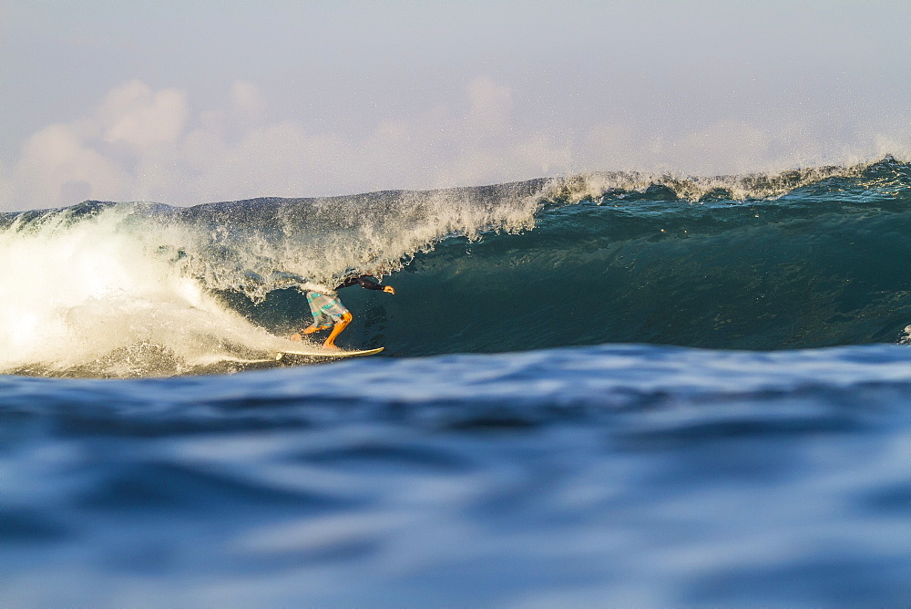 Photograph of surfer riding wave, Lakey Peak, central Sumbawa, Indonesia