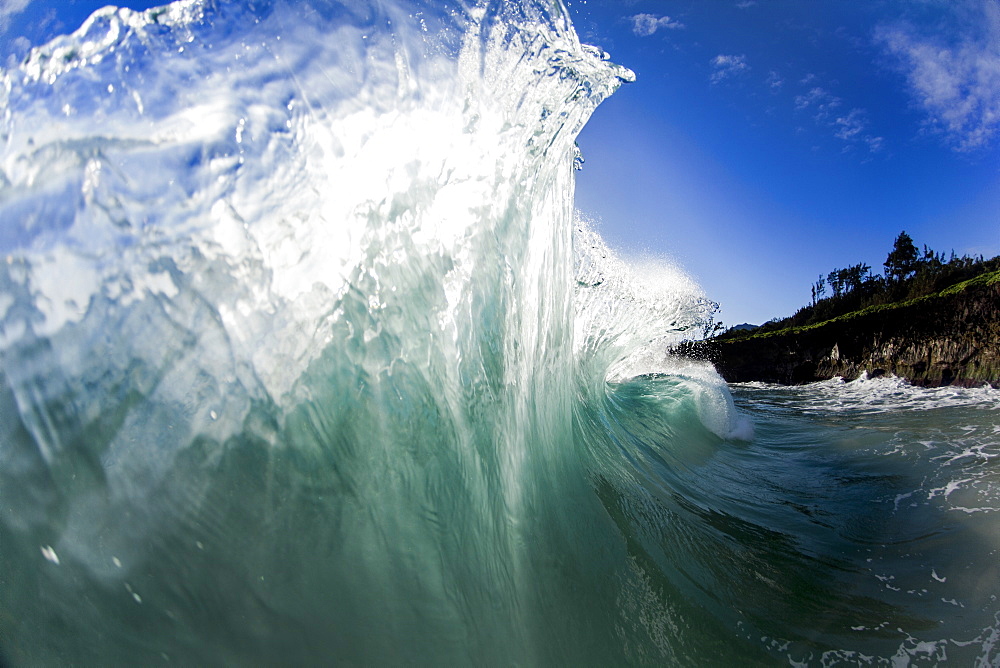 An ocean wave after being collided into by another wave on the East side of Oahu, Hawaii.