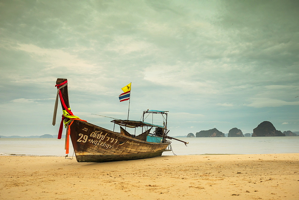 Long-tail boat moored on beach during daytime, Krabi, Krabi Province, Thailand