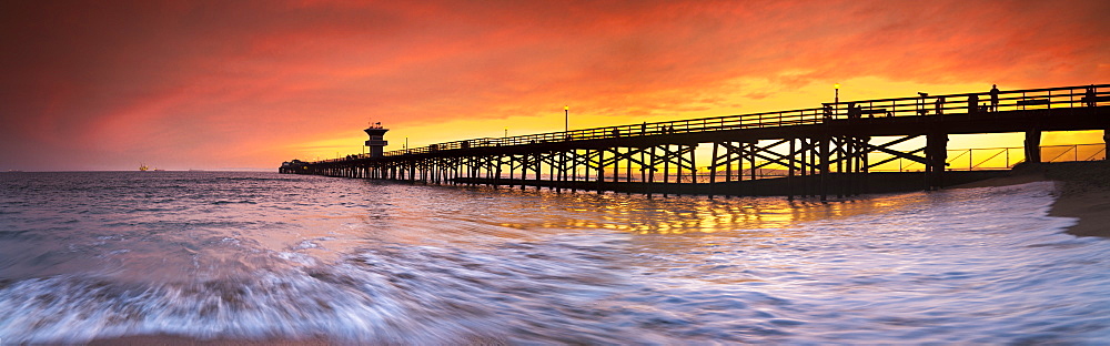 Long exposure panorama of waves and pier at seal Beach, Orange County, California, USA