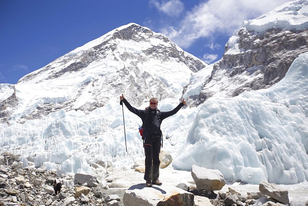 Happy male hiker with his hands in air in Everest Base Camp, Khumbu, Nepal