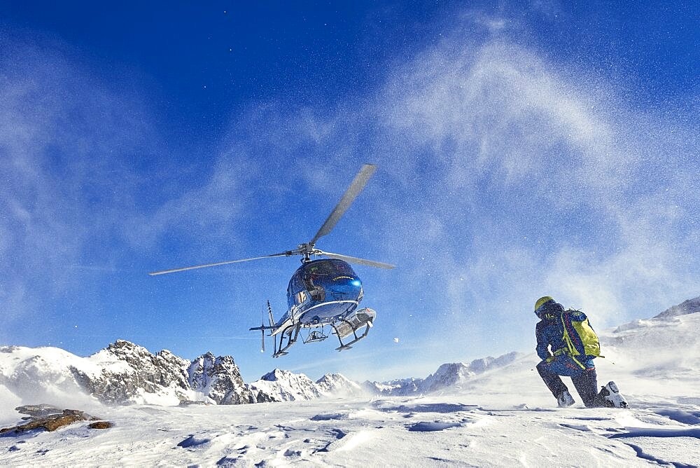 Skiers doing heliskiing in Formazza Valley, Piedmont, Italy