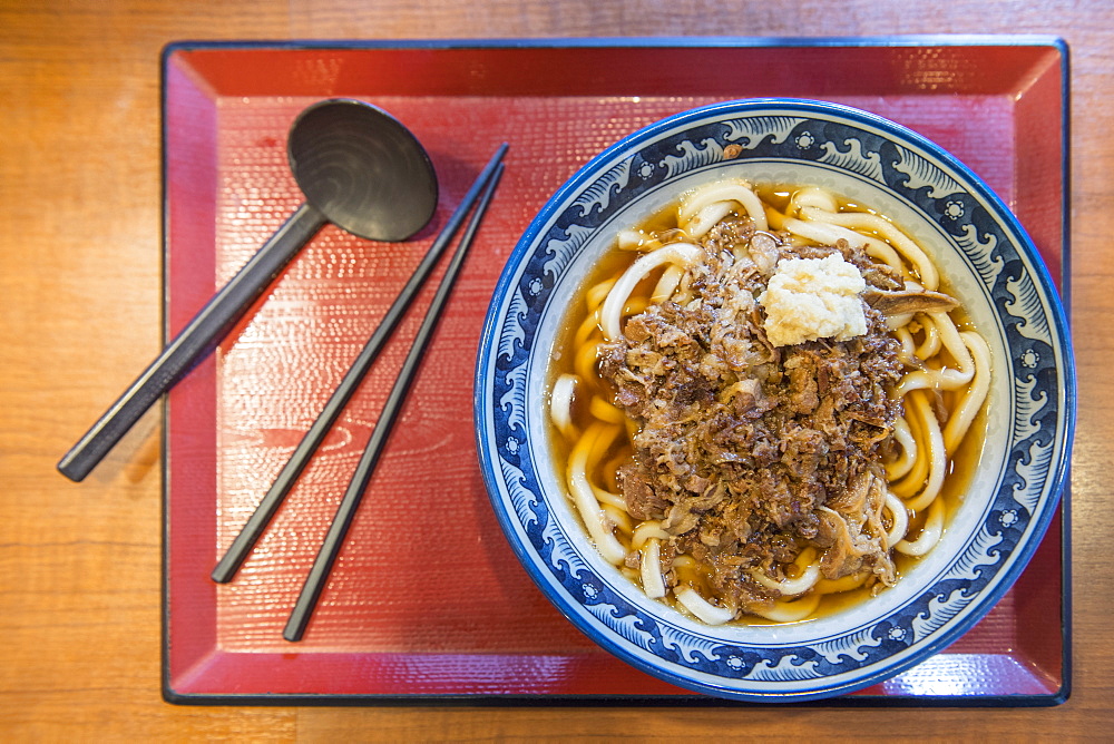 View from above of udon noodles with beef