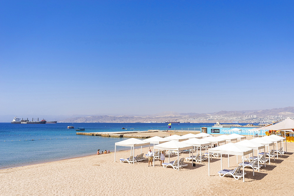 View of beach with cabanas of Gulf of Aqaba, Aqaba, Jordan