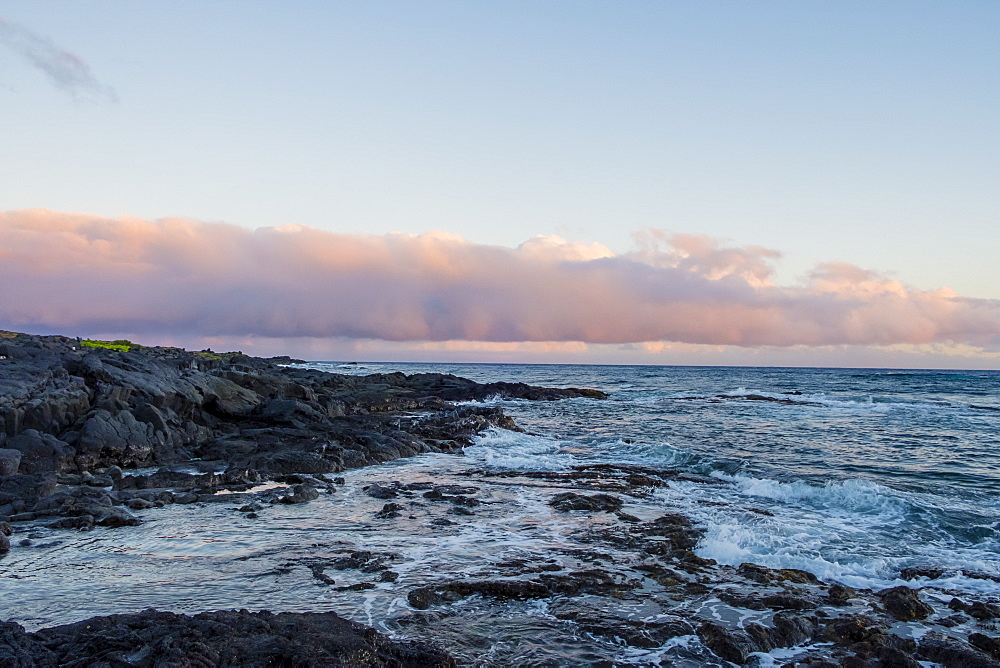 Sunset views with rocks and water from Halape Beach along the Puna Coast Trail in Hawaii Volcanoes National Park on the Big Island of Hawaii