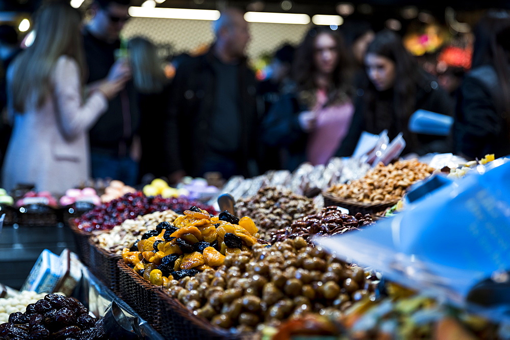 View of dried fruits and nuts on market stall at La Boqueria Market in Barcelona, Spain