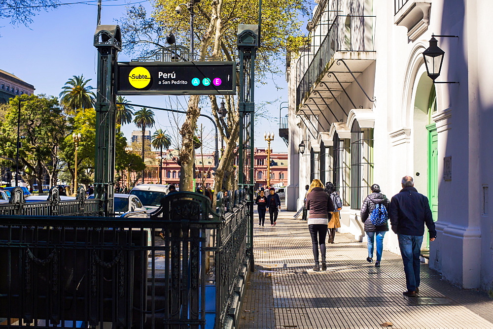 Entrance to the Subte metro and pedestrians walking on street in Buenos Aires, Argentina