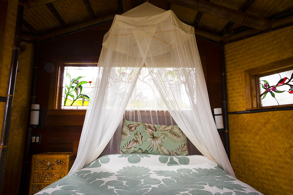 Honeymoon suite with a king bed at a treehouse in the rainforest near Hilo and Volcano on the Big Island of Hawaii