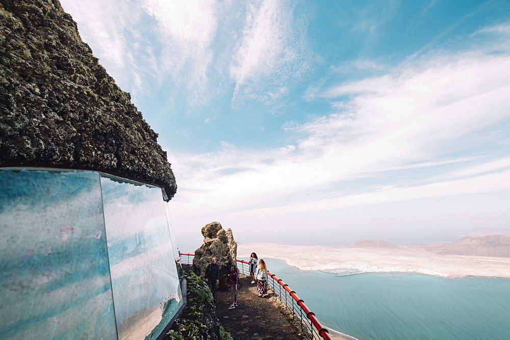 Tourists on viewpoint in front of Isla de La Graciosa, Mirador del Rio, Lanzarote, Spain