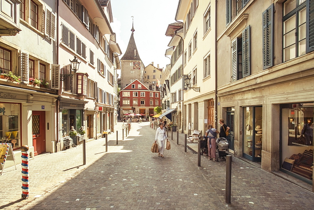 Scarce pedestrian traffic in picturesque of town street, Zurich, Switzerland