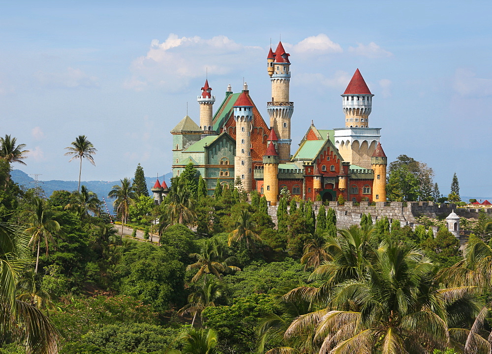 Palm trees in front of Fantasy World castle in Lemery, Tagaytay, Batangas, Philippines