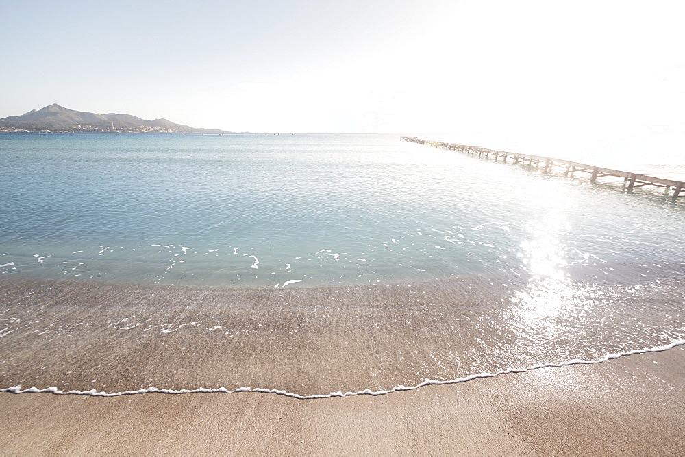 Landscape with sea and mountains at sunrise, Platja de Muro, Alcudia, Mallorca, Spain