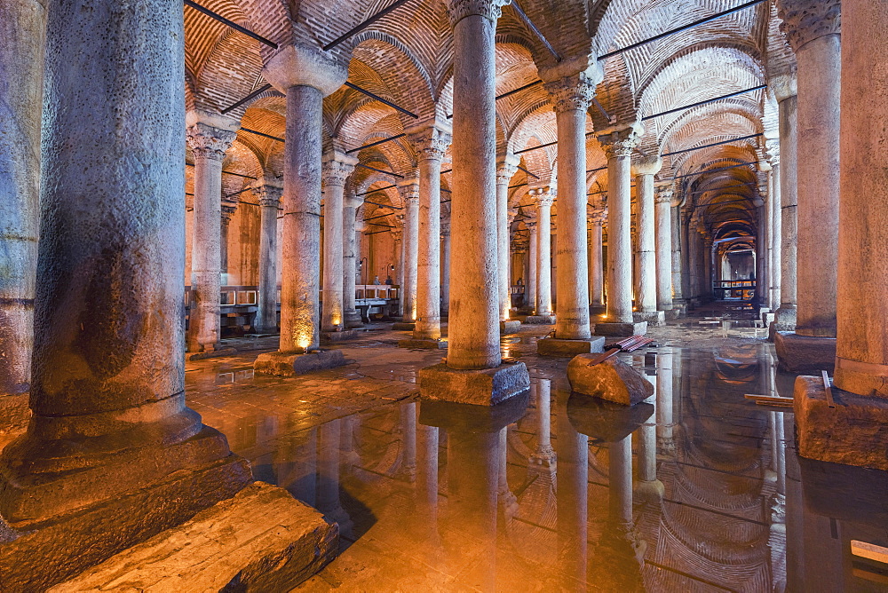 Basilica Cistern is a huge underground Roman water source held up with 336 marble columns, on some of them Medusa heads and decorations covering 9, 800 sq. meters, Istanbul, Turkey