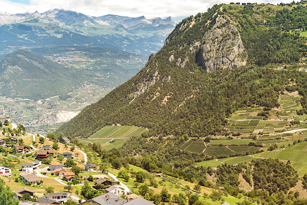 Landscape with mountains and beautifully located buildings in valley at daytime, Â Zermatt, Â Valais, Switzerland