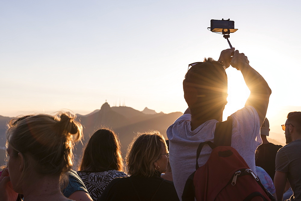 Rear view of group of tourists on Sugarloaf Mountain, Rio de Janeiro, Brazil