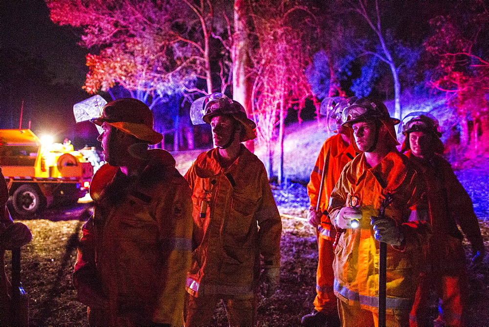 Firefighters waiting for approval from Incident Control to put fire on the ground, Guanaba, Queensland, Australia