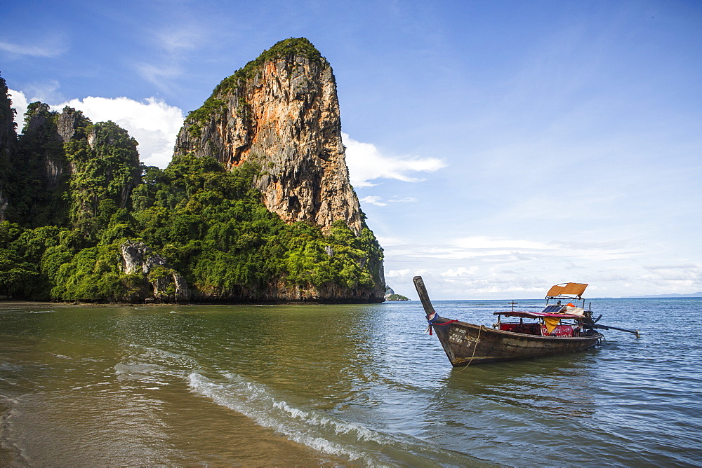 Railay Beach near Krabi, Thailand offers pristine ocean views on the Andaman Sea. The beach is a popular tourist destination located east of Phuket.