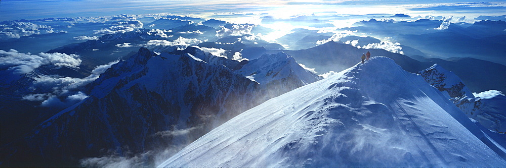 Panoramic of high mountain peaks in the Alps.