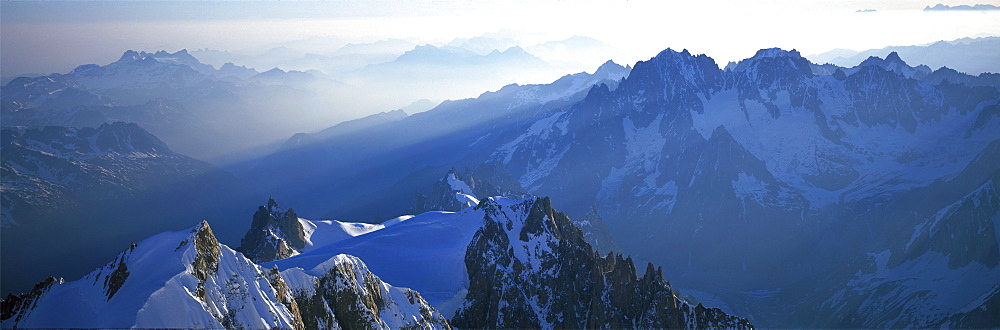 Panoramic of high mountain peaks in the Alps.