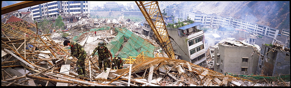 Rescue workers look for survivors  May 17 in Beichuan, China. The death toll in China's worst earthquake in 30 years could top 80, 000 according to the government.