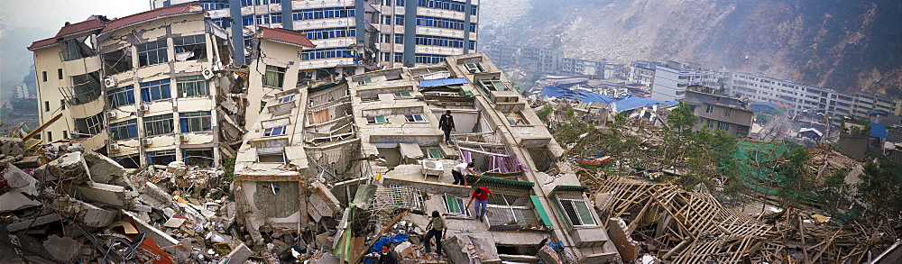 Survivors look for any signs of relatives and friends  May 17 in Beichuan, China. The death toll in China's worst earthquake in 30 years could top 80, 000 according to the government.