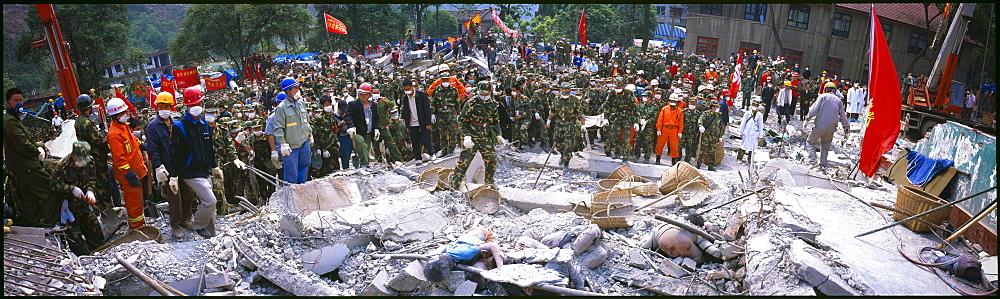 Rescue crews recover bodies from a school May 16 in Beichuan, China. The death toll in China's worst earthquake in 30 years could top 80, 000 according to the government.