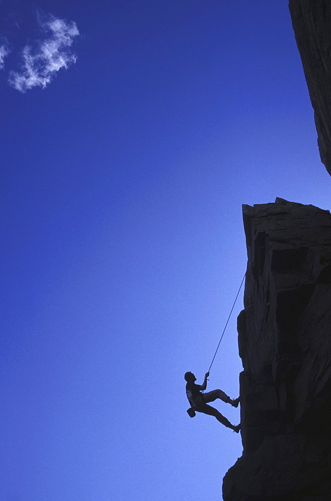 Rappelling off cliff at Acadia National Park, Maine