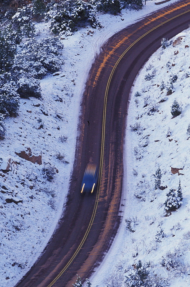 Car on winter road, s curve, Zion National Park, Utah