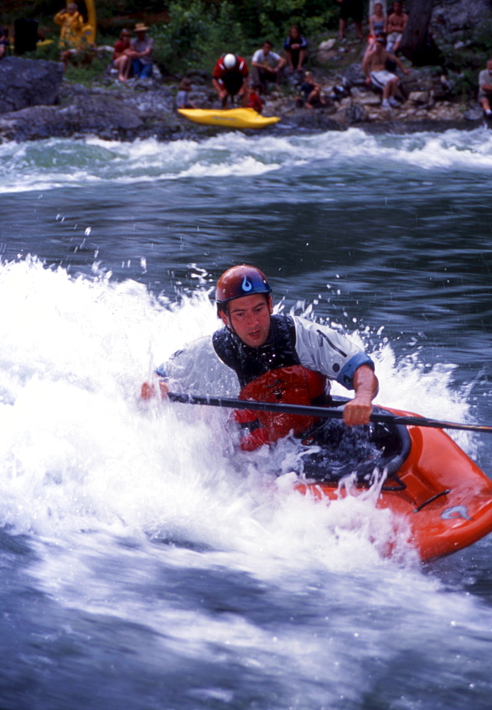 James Mole, professional kayaker... Every year, hardcore whitewater fanatics migrate to the riverside community of Kingfisher, British Columbia to play in the Shuswap River on one of the finest natural standing waves the province has to offer. This collection of images were taken over a hot July weekend during the 2003 Annual Kayak Rodeo competition.