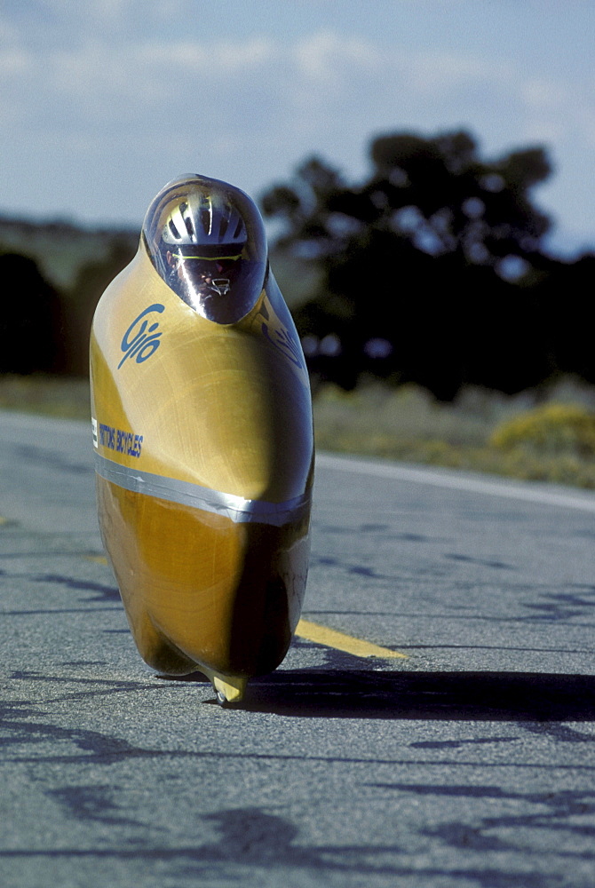 Engineers, athletes and enthusiasts gather on a lonely road in the San Luis Valley in central Colorado to try to break the speed record for a human powered vehicle. These vehicles are basically very, very aerodynamic bicycles.