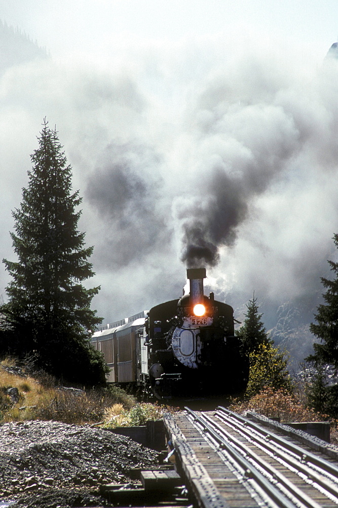 Coal-fired, steam-powered locomotive of the Durango & Silverton Narrow Gauge Railroad on the tracks near Silverton, Colorado.