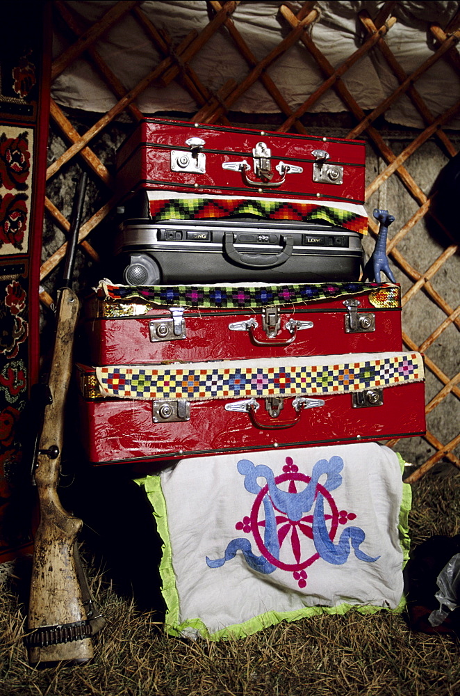 Interior of a ger. The internal layout of a ger is universal throughout Mongolia. Treasured possesions are kept in suitcases and boxes in the back of the ger. Tavanbogd National Park, Mongolia.