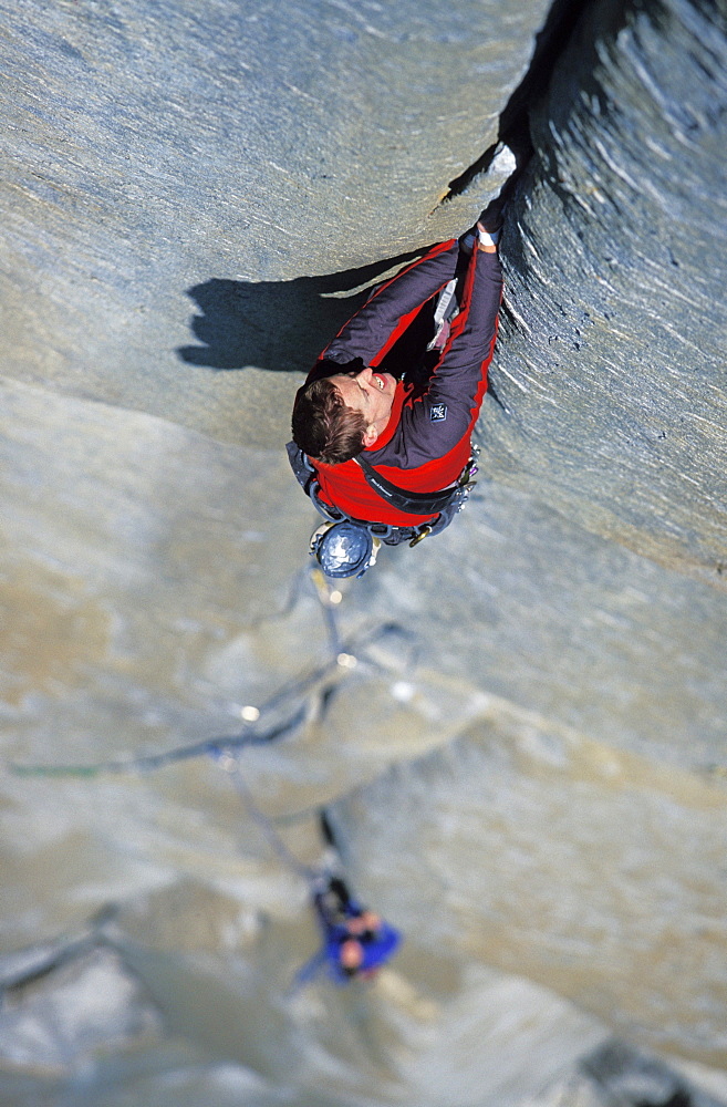 Tommy Caldwell rock climbs a crack on the headwall of The Salathe Wall 5.13 on El Capitan in Yosemite National Park, California. Caldwell is a professional rock climber and has free climbed more on El Capitan than any other climber.