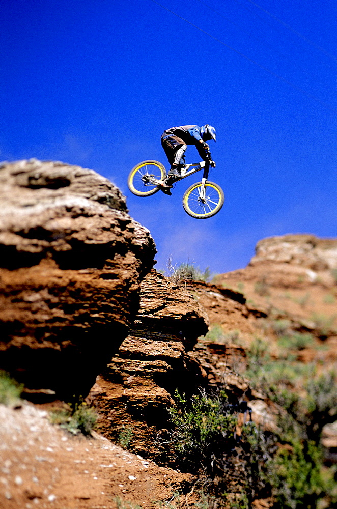 Wade Simmons making a jump on his mountain bike at the NWD 6 competition in Virgin, Utah.