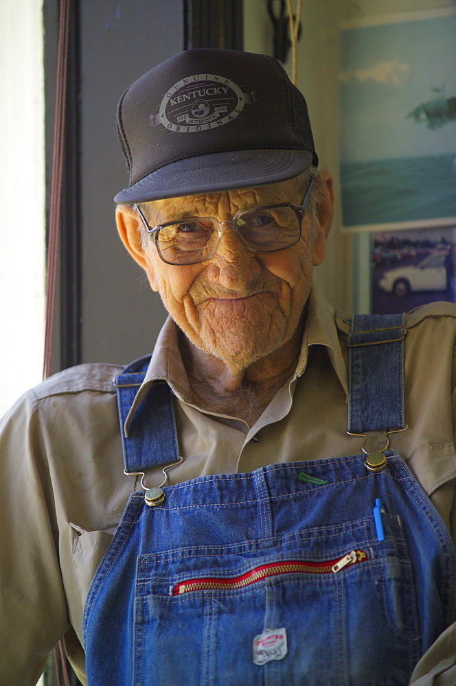 Earl Harmon relaxes in the window of the barbershop in Floyd, Virginia on April 15, 2005.  He often makes a daily stop at the shop to visit with friends and shoot the breeze. (Jonathan Kingston, Aurora)