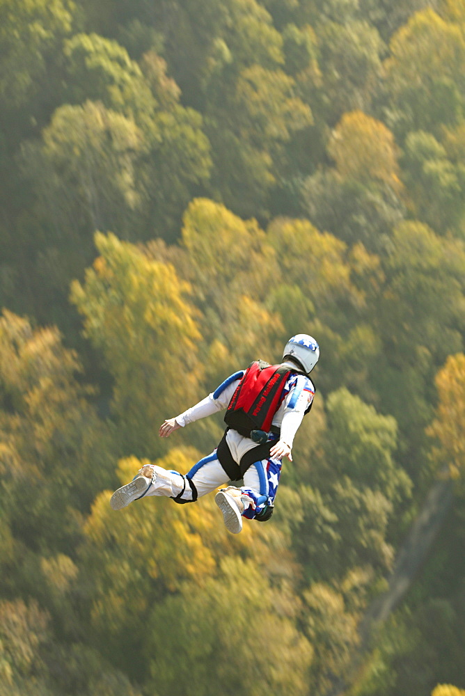 Unknown Base Jumper leaps off the Rt. 19 bridge over the New River Gorge at Fayetteville, WV for the Annual Bridge Day event.