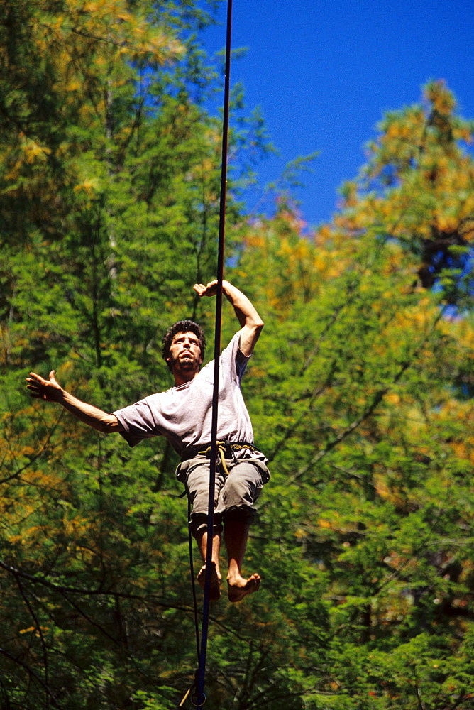 Bart Bledsoe walks a 100ft long and 200 foot high slackline set up at Torrent Falls near Slade, KY.