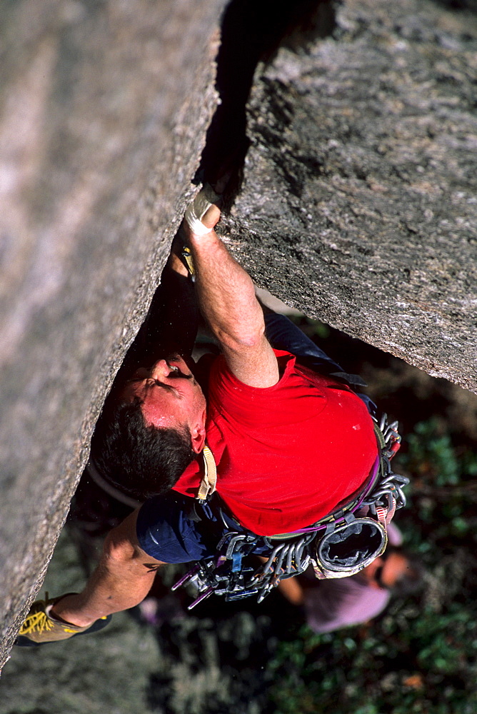 Bill Saul jams the strenuous crack called "Oh My God Corner" (5.10+) at the God Crags on Old Rag Mountain in the Shenandoah National Park, VA